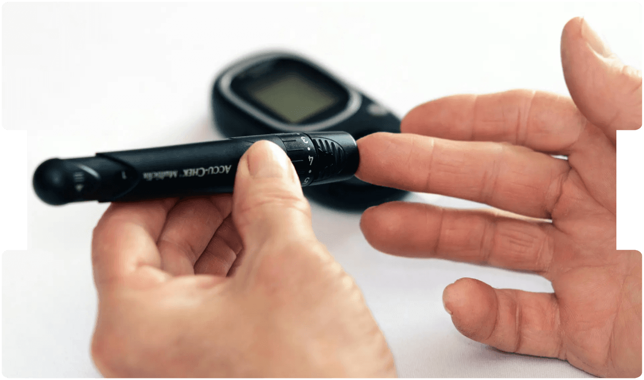 Person checking blood glucose levels with a glucometer, emphasising diabetes management and its relevance in medico-legal practice.